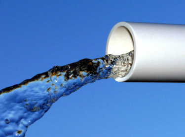 water flowing through pvc pipe